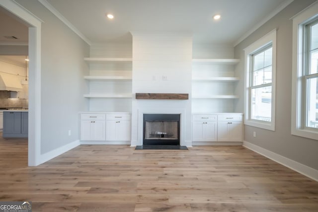 145 Holmes Ave, Athens, GA 30606 - unfurnished living room featuring ornamental molding, light wood finished floors, a fireplace, and recessed lighting