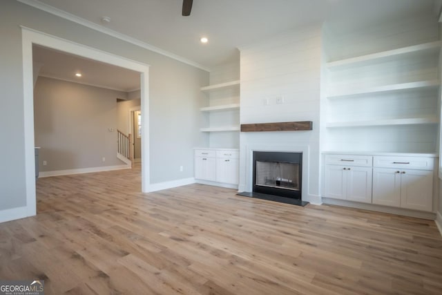 145 Holmes Ave, Athens, GA 30606 - unfurnished living room featuring ornamental molding, light wood-type flooring, a fireplace, recessed lighting, and ceiling fan