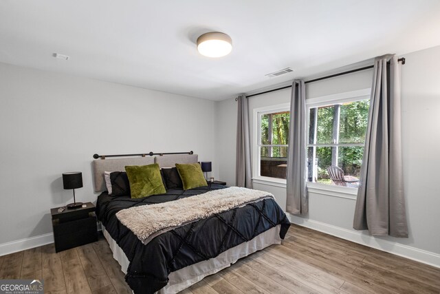 3648 Sope Creek Farm SE, Marietta, GA 30067 - bedroom with baseboards and wood finished floors