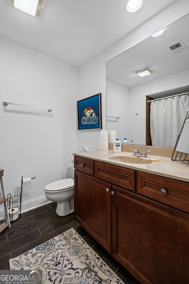 3648 Sope Creek Farm SE, Marietta, GA 30067 - full bath with vanity, wood finish floors, and a shower with shower curtain