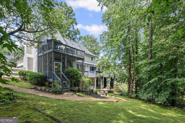 3648 Sope Creek Farm SE, Marietta, GA 30067 - rear view of house featuring a balcony, a lawn, a sunroom, and stairway