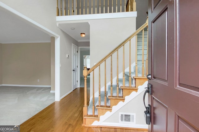 1197 Kenilworth Trce, Snellville, GA 30078 - entryway with stairs, crown molding, and wood finished floors