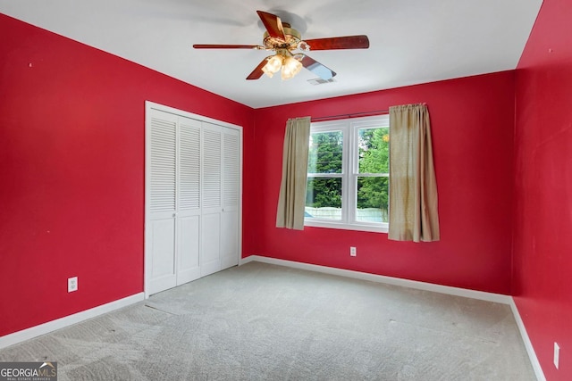 1197 Kenilworth Trce, Snellville, GA 30078 - unfurnished bedroom with carpet, a closet, and ceiling fan