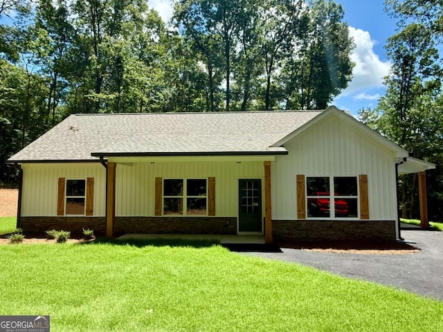 TRACT3 Grogan Rd, Buchanan, GA 30113 - ranch-style house with roof with shingles, a front lawn, and stone siding