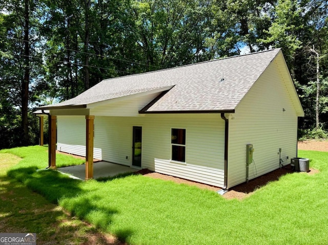 TRACT3 Grogan Rd, Buchanan, GA 30113 - rear view of house featuring a shingled roof, a yard, and a patio