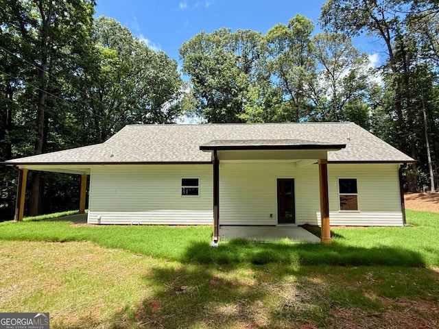 TRACT3 Grogan Rd, Buchanan, GA 30113 - back of property featuring roof with shingles, a yard, a patio, and a carport