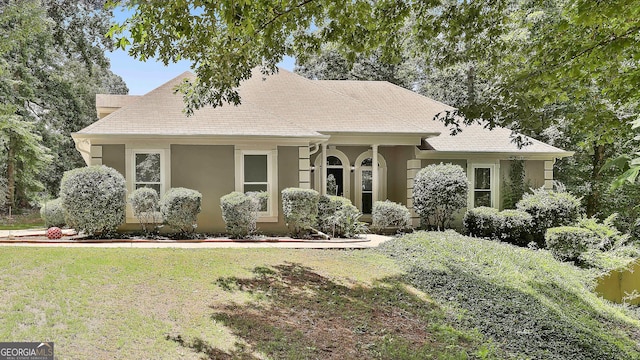 77 Springfield Ct, Newnan, GA 30265 - view of front of property with stucco siding and a front lawn