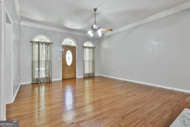 77 Springfield Ct, Newnan, GA 30265 - entryway with ceiling fan, light wood-type flooring, crown molding, and a textured ceiling