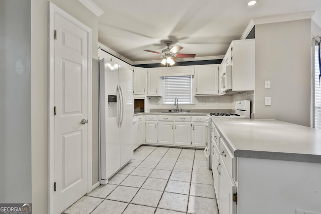 77 Springfield Ct, Newnan, GA 30265 - kitchen with white appliances, a ceiling fan, light tile patterned flooring, crown molding, and white cabinets
