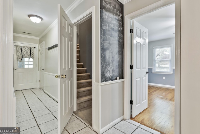 77 Springfield Ct, Newnan, GA 30265 - corridor featuring light tile patterned floors, ornamental molding, stairs, and plenty of natural light