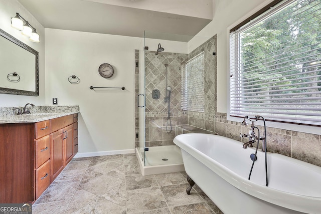 77 Springfield Ct, Newnan, GA 30265 - full bathroom with vanity, a soaking tub, a shower stall, and stone finish flooring