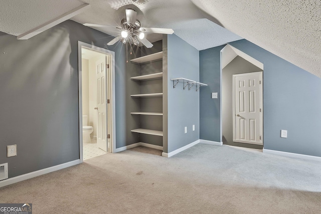 77 Springfield Ct, Newnan, GA 30265 - bonus room featuring a ceiling fan, carpet, a textured ceiling, and vaulted ceiling