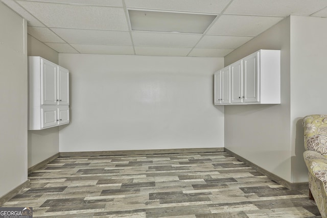 77 Springfield Ct, Newnan, GA 30265 - below grade area featuring a drop ceiling and wood finished floors