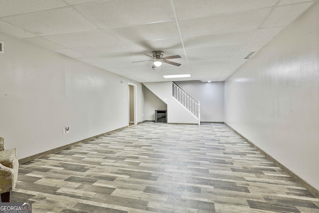77 Springfield Ct, Newnan, GA 30265 - finished below grade area with wood finished floors, stairway, a paneled ceiling, and a ceiling fan