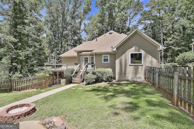 77 Springfield Ct, Newnan, GA 30265 - view of front of property with stucco siding, a deck, a fenced backyard, and stairs
