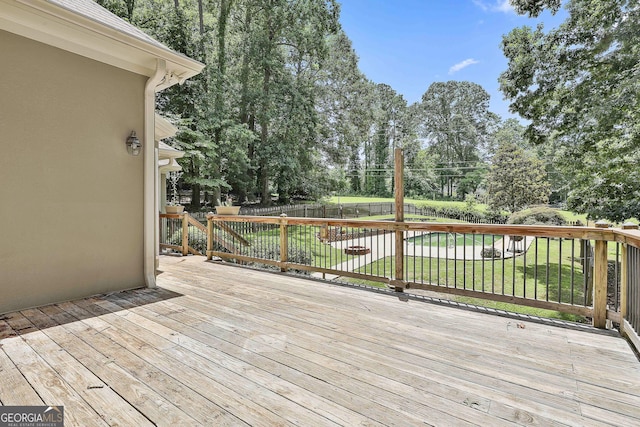 77 Springfield Ct, Newnan, GA 30265 - wooden deck featuring view of wooded area and a fenced backyard