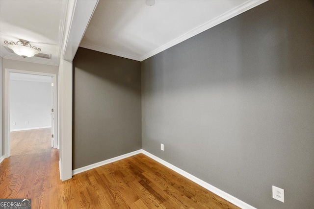 133 N Wellington, Macon, GA 31210 - spare room with ornamental molding and wood finished floors