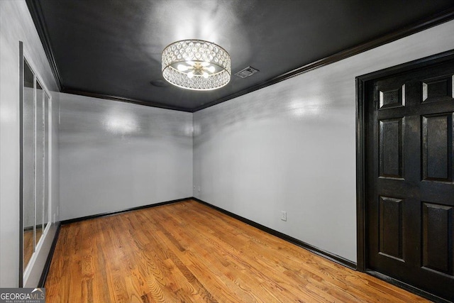 133 N Wellington, Macon, GA 31210 - unfurnished room with crown molding, a chandelier, and wood finished floors