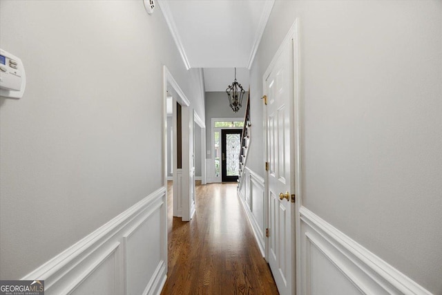 133 N Wellington, Macon, GA 31210 - hall with a decorative wall, dark wood-style floors, a wainscoted wall, ornamental molding, and a chandelier