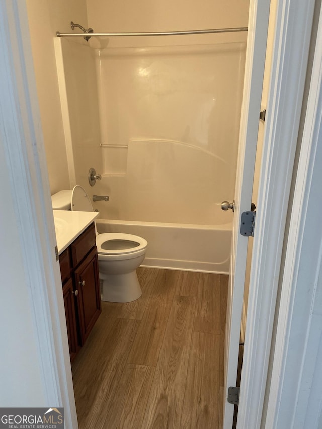 1238 Polk Xing, Mcdonough, GA 30252 - full bath with vanity, wood finished floors, and washtub / shower combination