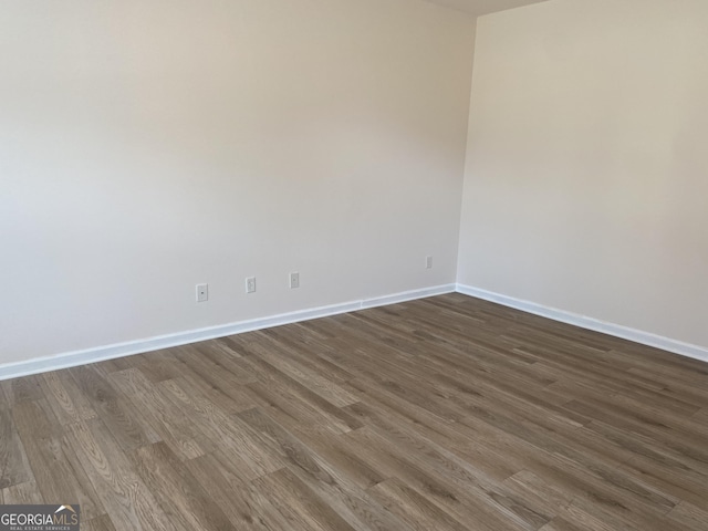 1238 Polk Xing, Mcdonough, GA 30252 - empty room with dark wood-type flooring