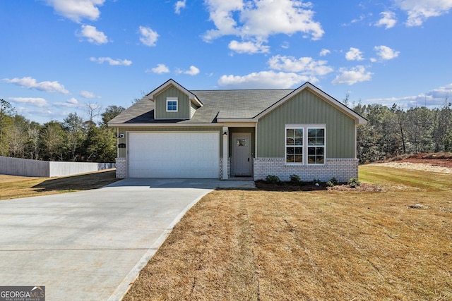 110 Golden Ingot Ct, Perry, GA 31069 - view of front of house with brick siding, concrete driveway, and an attached garage