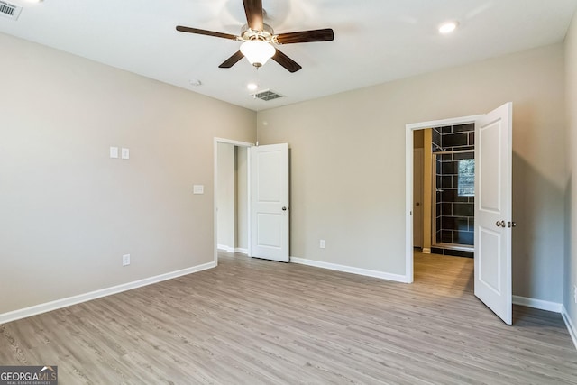 110 Golden Ingot Ct, Perry, GA 31069 - unfurnished bedroom with light wood-style floors, a walk in closet, recessed lighting, ceiling fan, and a closet