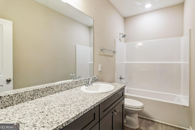 110 Golden Ingot Ct, Perry, GA 31069 - full bathroom featuring vanity, shower / bathtub combination, and wood finished floors