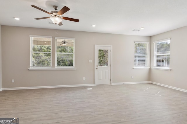 110 Golden Ingot Ct, Perry, GA 31069 - unfurnished living room featuring light wood-type flooring, ceiling fan, and recessed lighting