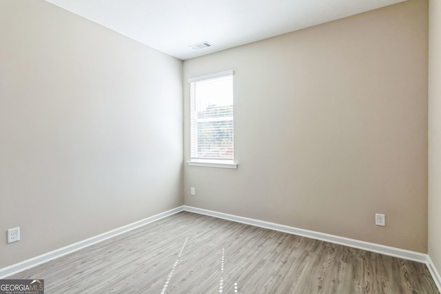 110 Golden Ingot Ct, Perry, GA 31069 - spare room featuring light wood-style flooring and baseboards