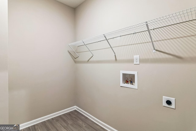 110 Golden Ingot Ct, Perry, GA 31069 - washroom with electric dryer hookup, hookup for a washing machine, and dark wood-style flooring