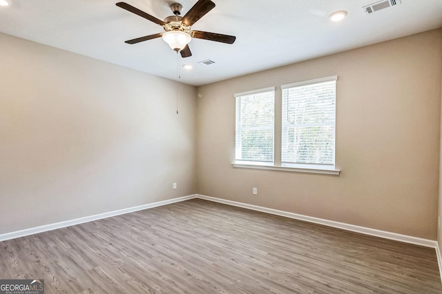 110 Golden Ingot Ct, Perry, GA 31069 - spare room featuring wood finished floors, a ceiling fan, and recessed lighting