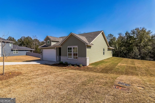 110 Golden Ingot Ct, Perry, GA 31069 - view of front of home with brick siding, concrete driveway, an attached garage, and a shingled roof