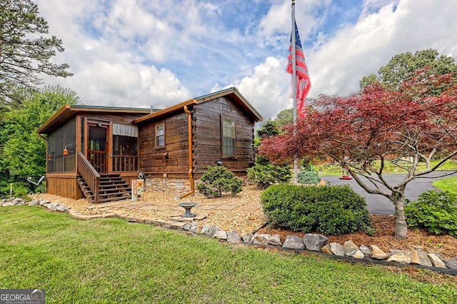 41 Wilderness Ct, Blairsville, GA 30512 - view of front facade featuring a sunroom, a front yard, and stairway