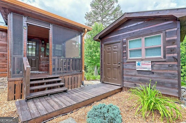 41 Wilderness Ct, Blairsville, GA 30512 - wooden deck featuring a sunroom and an outdoor structure