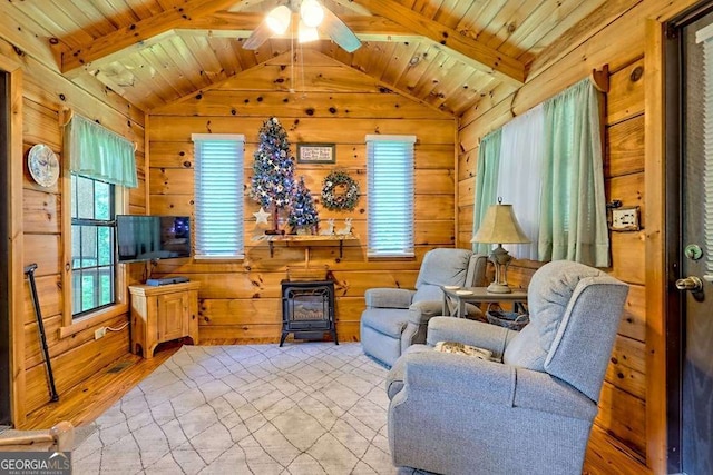 41 Wilderness Ct, Blairsville, GA 30512 - sitting room with a wood stove, wood finished floors, wooden walls, wooden ceiling, and ceiling fan