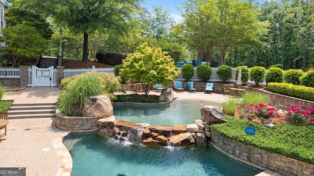 7114 Nightfall Ln, Gainesville, GA 30506 - swimming pool with view of scattered trees and a gate