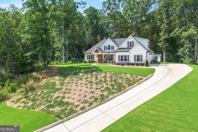 213 River Trl, Ball Ground, GA 30107 - modern inspired farmhouse with driveway, a front lawn, and covered porch