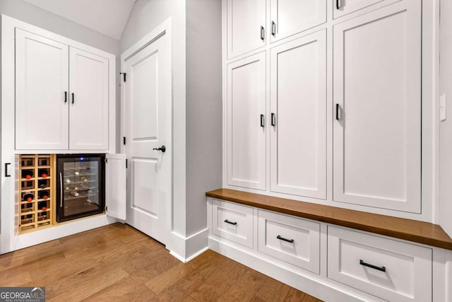 213 River Trl, Ball Ground, GA 30107 - mudroom featuring light wood-style floors and beverage cooler