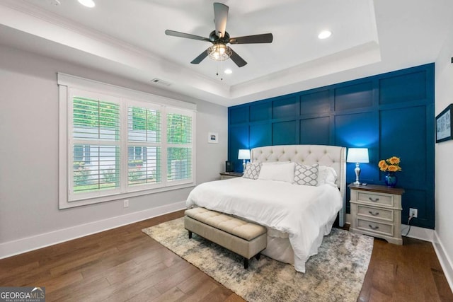213 River Trl, Ball Ground, GA 30107 - bedroom featuring a raised ceiling, dark wood finished floors, recessed lighting, a ceiling fan, and crown molding