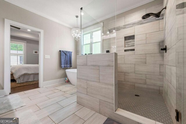 213 River Trl, Ball Ground, GA 30107 - full bathroom with tiled shower, ornamental molding, and a freestanding tub