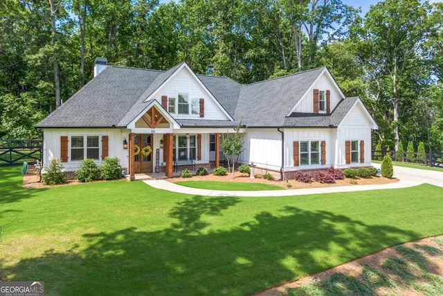 213 River Trl, Ball Ground, GA 30107 - modern farmhouse with board and batten siding, a chimney, a shingled roof, view of scattered trees, and a porch