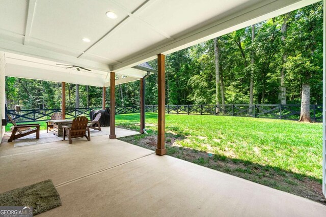 213 River Trl, Ball Ground, GA 30107 - fenced backyard featuring a patio and an outdoor fire pit