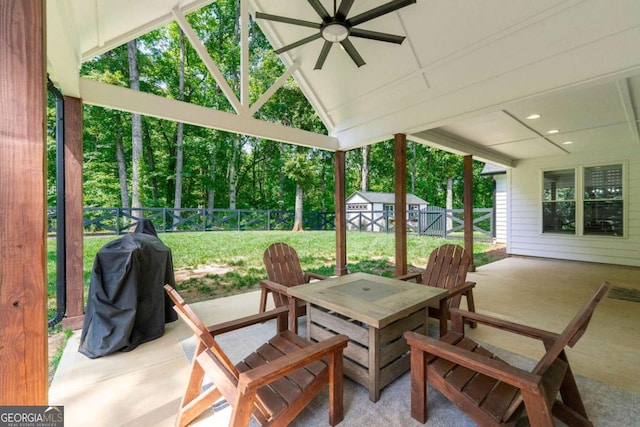 213 River Trl, Ball Ground, GA 30107 - fenced backyard with a patio, ceiling fan, outdoor dining area, a storage unit, and grilling area