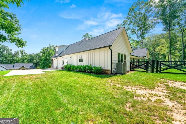213 River Trl, Ball Ground, GA 30107 - rear view of house featuring board and batten siding, driveway, a gate, roof with shingles, and an attached garage