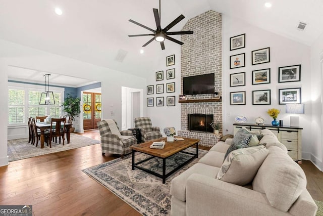 213 River Trl, Ball Ground, GA 30107 - living area featuring ceiling fan, wood finished floors, a fireplace, high vaulted ceiling, and recessed lighting