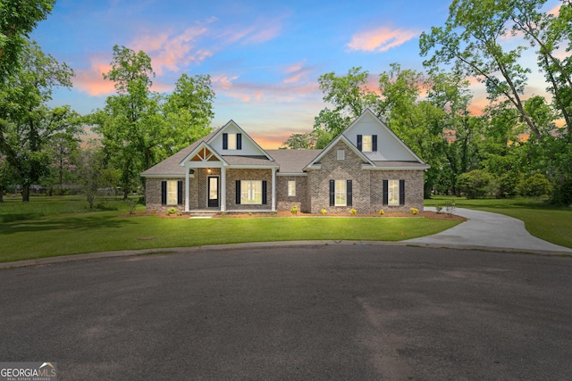 19 Honeysuckle Dr, Claxton, GA 30417 - view of front facade featuring a lawn and brick siding