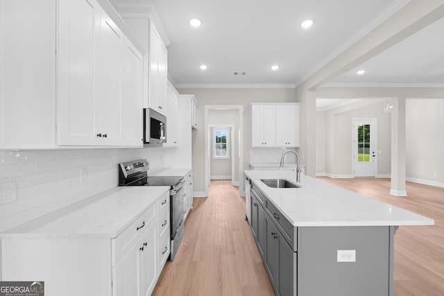 19 Honeysuckle Dr, Claxton, GA 30417 - kitchen with appliances with stainless steel finishes, gray cabinetry, white cabinets, plenty of natural light, and recessed lighting