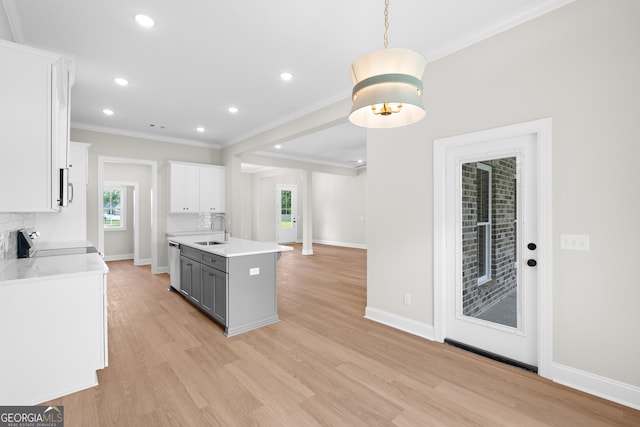 19 Honeysuckle Dr, Claxton, GA 30417 - kitchen with stove, stainless steel dishwasher, ornamental molding, plenty of natural light, and light countertops