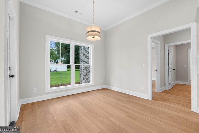 19 Honeysuckle Dr, Claxton, GA 30417 - spare room featuring light wood-style flooring and crown molding